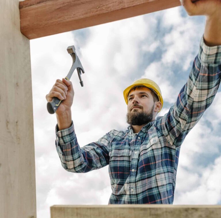 construction-worker-with-hammer-hard-hat-building-roof-house